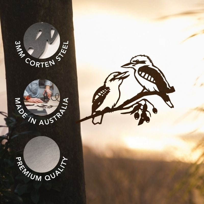 Featuring a striking Pair of Kookaburras by Metalbird Australia, this metal artwork showcases two birds perched on a branch with three circular labels: 3MM Corten Steel, Made in Australia, and Premium Quality. Set against a vibrant sunset and tree backdrop, it beautifully captures the essence of Australian bird silhouette garden art—adding an authentic and distinctive touch to your outdoor space.