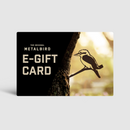 The Metalbird Australia E-Gift Card features a bird silhouette on a tree branch against a black background, echoing its yard art inspiration with blurred outdoor scenery and warm light.