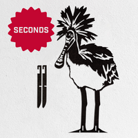The Metalbird Australia - Seconds "Metalbird Seconds" features a crowned bird wall art with detachable metal legs. Marked as "SECONDS" for minor flaws, this discounted garden piece is shown on a white background.